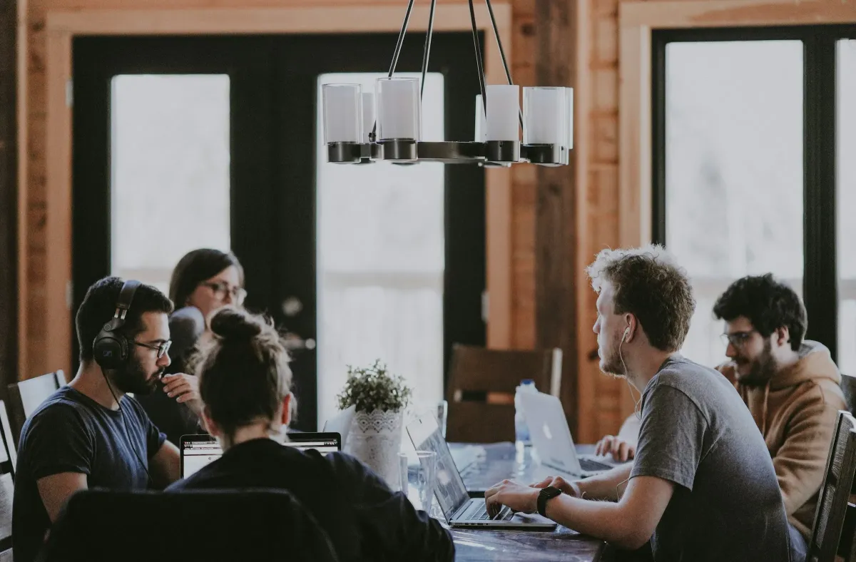 Colleagues working together at a shared table