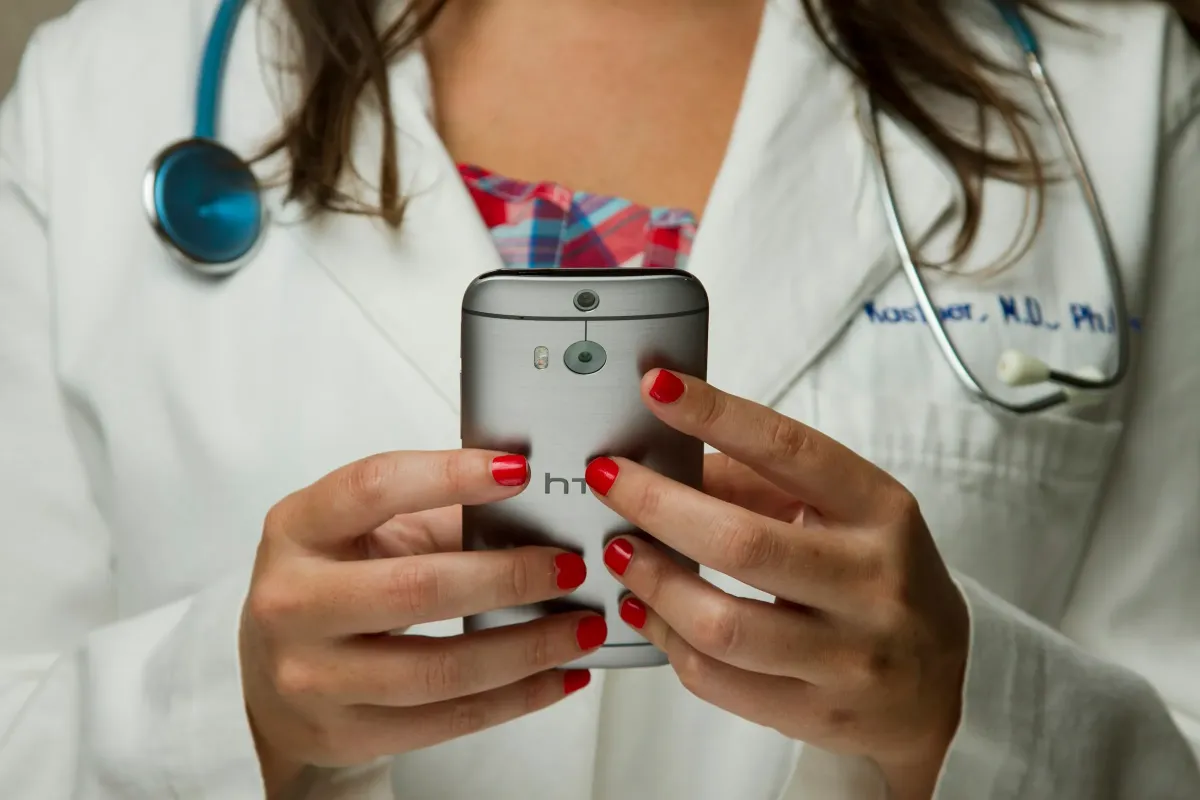 A healthcare professional using a smartphone