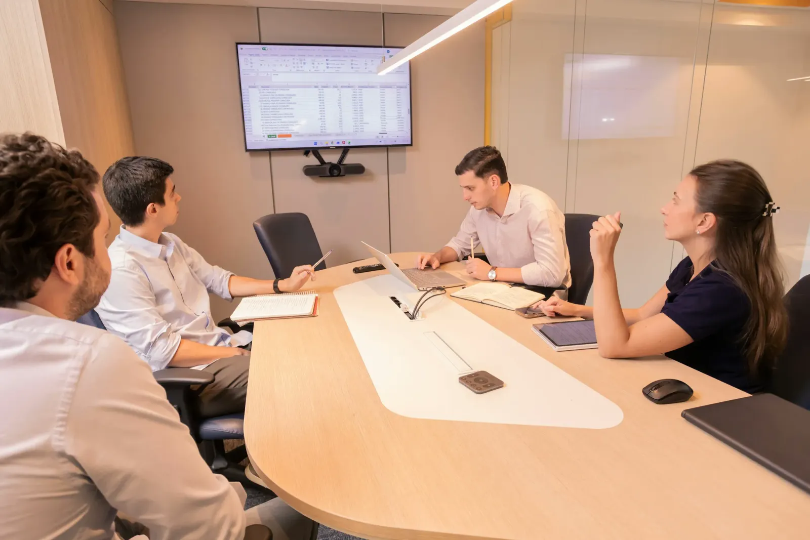 Colleagues planning around a conference table