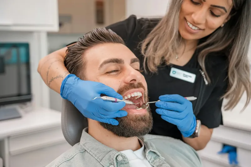 A dentist examining a patient